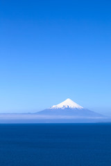 Fototapeta premium Osorno volcano and Llanquihue lake photographed from Puerto Varas, Chile