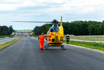 Rescue helicopter taking off from the route