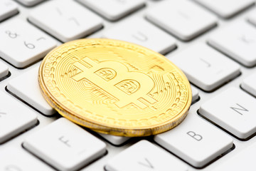 cryptocurrency, virtual currency  bitcoin, on keyboard