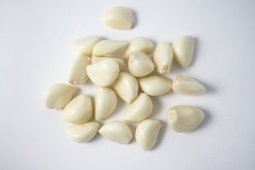 Fototapeta na wymiar Garlic cloves close up isolated on the white background
