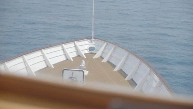 Vessel heading to the horizon, calm sea. Head of ship, motor boat or luxury yacht.