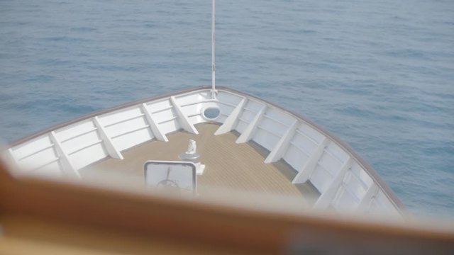 Vessel heading to the horizon, calm sea. Head of ship, motor boat or luxury yacht.