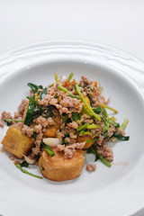 tofu stir fry with pork on white dish