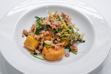 tofu stir fry with pork on white dish