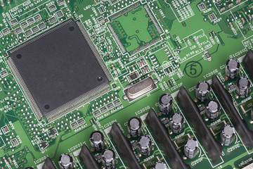 Electronic components are mounted on the device board Chips diodes capacitors chokes Close-up