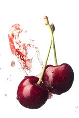 Fototapeta na wymiar Fresh and juicy cherry fruit served in a splash of water