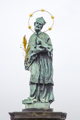 Fototapeta premium Charles Bridge in Prague. Deity on the power. Light.