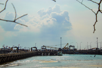 The fishing pier and ferry boats. On the island.