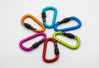 Colorful matte metal aluminum snap hook isolated on white background.