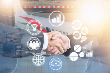 Double exposure of business people handshake with new icon and airplane