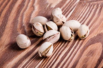 pistachios dry on wood desk