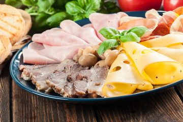 Cold meat platter with ham, prosciutto, bacon and cheese
