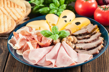 Cold meat platter with ham, prosciutto, bacon and cheese