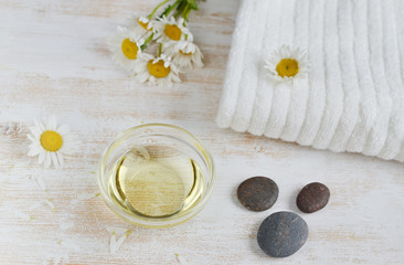 Fototapeta na wymiar Natural ingredients for homemade body, face salt scrub with chamomile flowers, honey and oil, SPA concept, white background