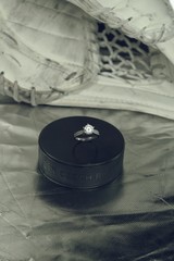 Engagement Ring on hockey puck with the inscription `Czech Republic` on the SILVER background.Black...