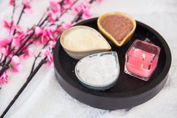 Herbal in spa in wooden tray for massage with flower and candle