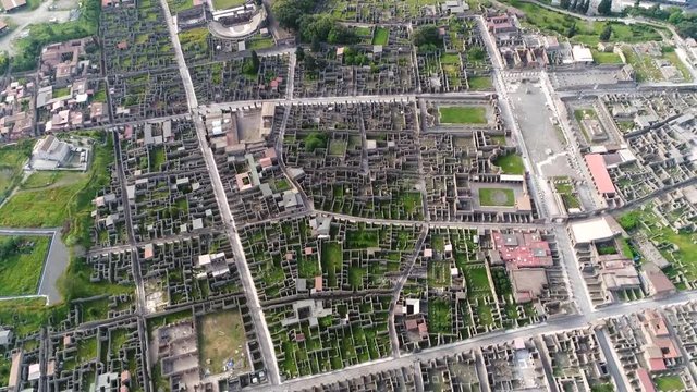 Aerial footage of Pompeii an ancient Roman city near modern Naples Italy in the territory of the comune of Pompei it was buried under volcanic ash and pumice in the eruption of Mount Vesuvius 4k