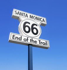 ROUTE 66, END OF THE TRAIL, ROAD SIGN IN SANTA MONICA PIER, LOS ANGELES, CALIFORNIA, UNITED STATES. SUNNY DAY, BLUE SKY, PACIFIC OCEAN.