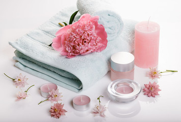 Obraz na płótnie Canvas Spa concept in Valentine's Day, Birthday Day, pink peony, candles, blue towels, flowers. Spring or summer background