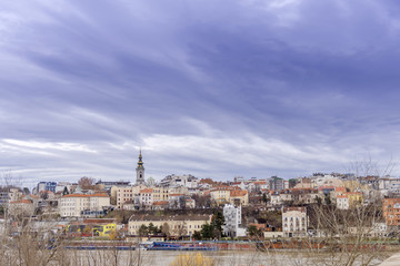 BELGRADE, SERBIA - NOVEMBER 4, 2017: City view with dramatic sky from the brige with river Sava downtown, Serbia
