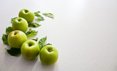 green apples on the white table