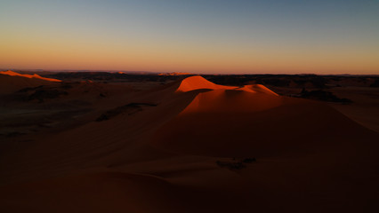 Fototapeta na wymiar Sunset view to Tin Merzouga dune at Tassili nAjjer national park in Algeria