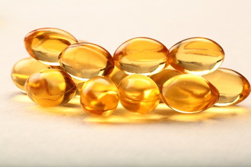Healthy cod fish liver oil capsules in white background