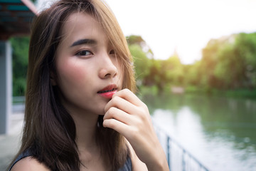 Portrait Happy woman. beauty girl smile face..Close up lady skin confident cute model healthy care..Pretty Teenage female relax expressive..green nature outdoor summer lifestyle.