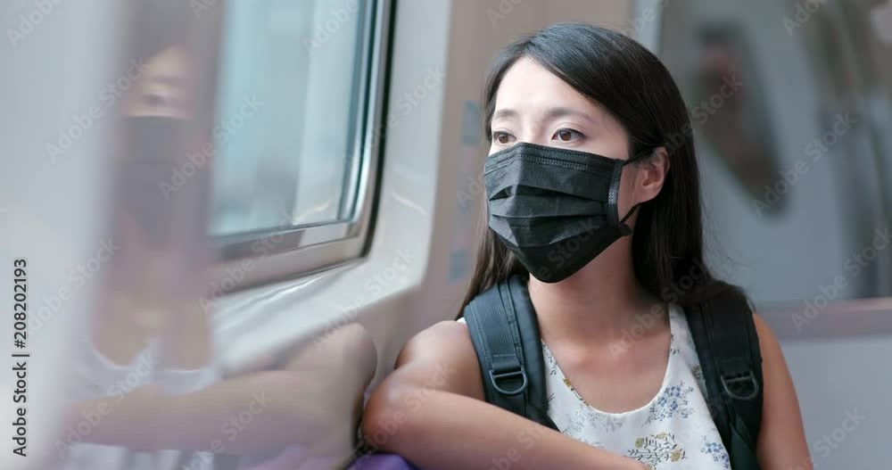 Poster woman wearing mask for protection and taking the train in taipei city metro