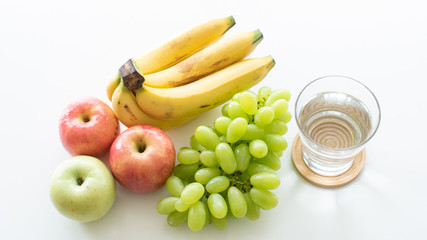 healthy food with banana grape and apple with drinking water