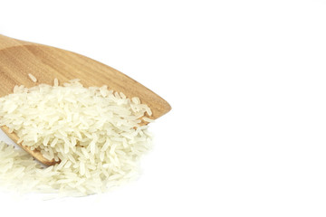 Jasmine rice on wooden ladle.