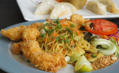 Shrimp tempura with fried noodles.