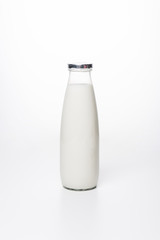 close-up shot of fresh milk in bottle on white surface