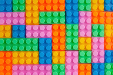 Colourful plastic construction blocks. Top view