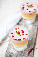 Panna cotta in layers with vanilla and strawberries