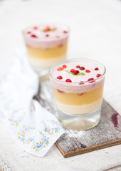 Panna cotta in layers with vanilla and strawberries
