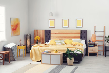 Interior of beautiful room with comfortable double bed