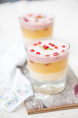 Panna cotta in layers with vanilla and strawberries