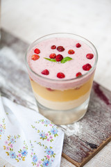 Panna cotta in layers with vanilla and strawberries