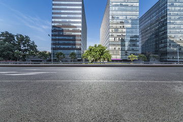 Fototapeta na wymiar Empty Road with modern business office building 