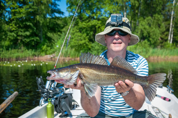 Angler with june caught walleye