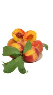 Some peaches with leaves