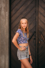 Fototapeta premium teenage female in a summer time spend time near the art school