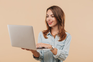 Fototapeta premium Portrait of a cheerful young girl in summer clothes