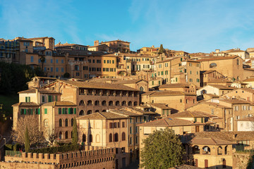 Naklejka premium Siena with old houses in the evening. Tuscany, Italy, Europe