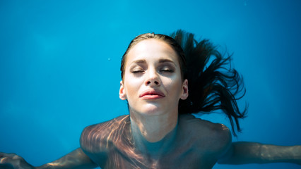 Young woman beauty portrait in water