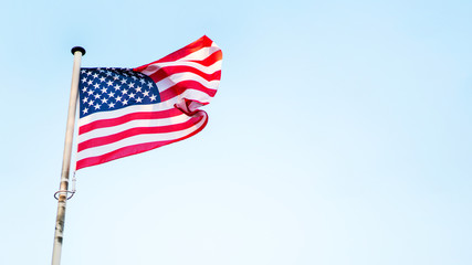 Obraz premium USA flag fluttering on the wind. American holidays banner.