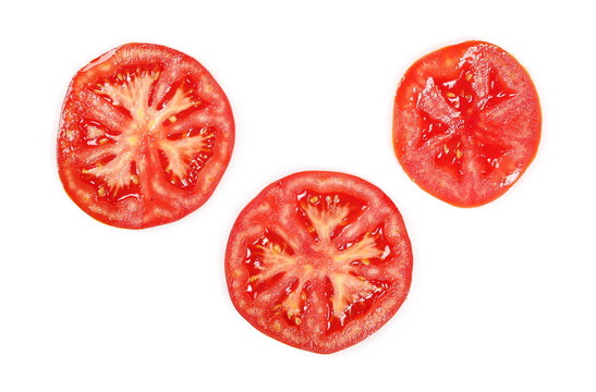 Fresh ripe, red tomatoes cut in half isolated on white background, top view