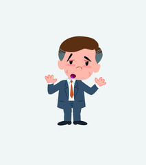 Businessman makes a gesture of tired resignation.