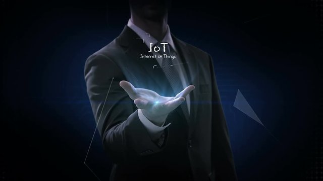 Businessman opens palm, IoT, Hand drawing Internet of things icon. 4k movie.